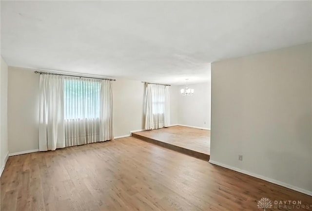 2184 Broadbent Way, Dayton, OH 45440 - unfurnished room with a chandelier and wood finished floors