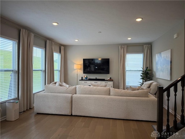 11916 Abbeytown Dr, Colerain Twp, OH 45251 - living area featuring plenty of natural light, wood finished floors, recessed lighting, and stairs