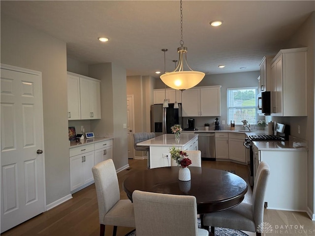 11916 Abbeytown Dr, Colerain Twp, OH 45251 - kitchen featuring appliances with stainless steel finishes, light countertops, white cabinets, and recessed lighting