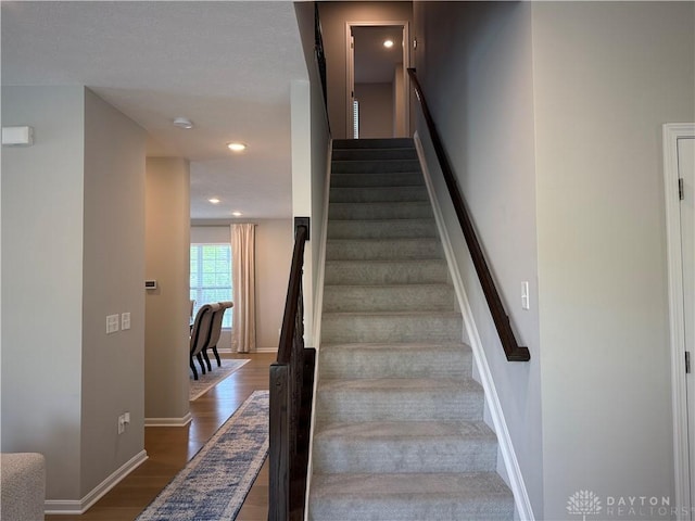 11916 Abbeytown Dr, Colerain Twp, OH 45251 - stairway featuring wood finished floors and recessed lighting