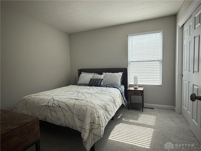 11916 Abbeytown Dr, Colerain Twp, OH 45251 - bedroom with a closet, carpet flooring, and a textured ceiling