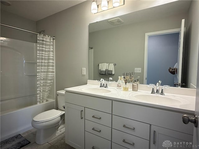 11916 Abbeytown Dr, Colerain Twp, OH 45251 - full bath with double vanity, tile patterned flooring, and shower / bath combo with shower curtain