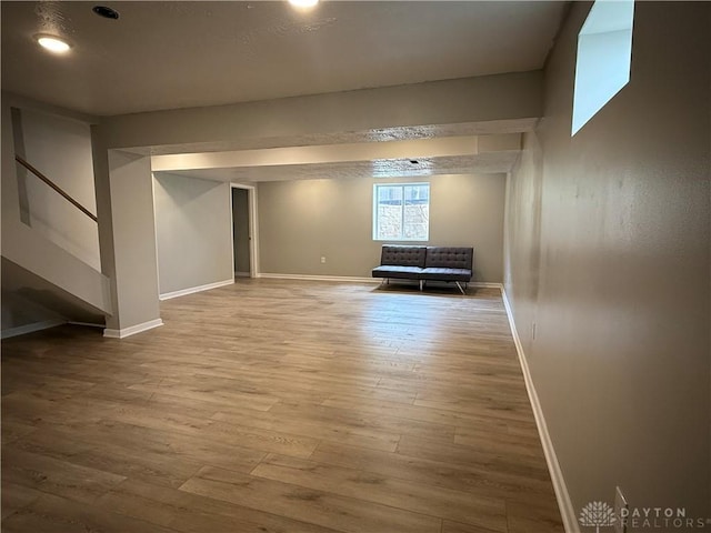 11916 Abbeytown Dr, Colerain Twp, OH 45251 - below grade area with wood finished floors and stairs
