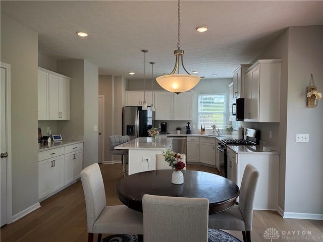 11916 Abbeytown Dr, Colerain Twp, OH 45251 - dining room featuring wood finished floors and recessed lighting
