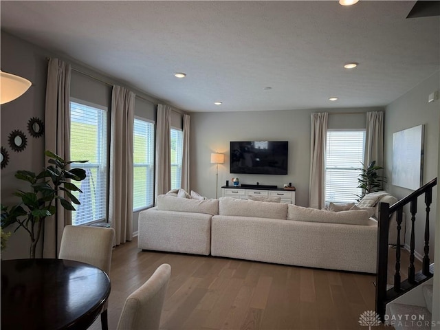 11916 Abbeytown Dr, Colerain Twp, OH 45251 - living room featuring healthy amount of natural light, wood finished floors, and recessed lighting