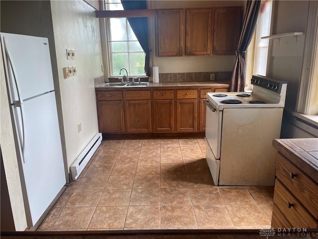 6008 Delisle-Fourman Rd, Arcanum, OH 45304 - kitchen with white appliances, a baseboard radiator, brown cabinets, tile countertops, and open shelves