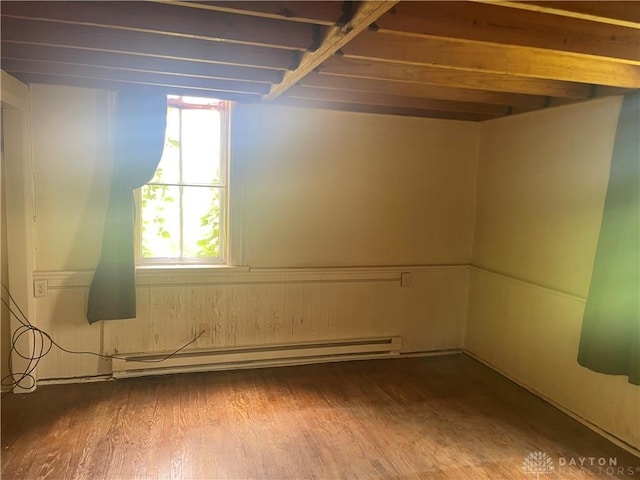 6008 Delisle-Fourman Rd, Arcanum, OH 45304 - basement with a baseboard heating unit, plenty of natural light, and wood finished floors
