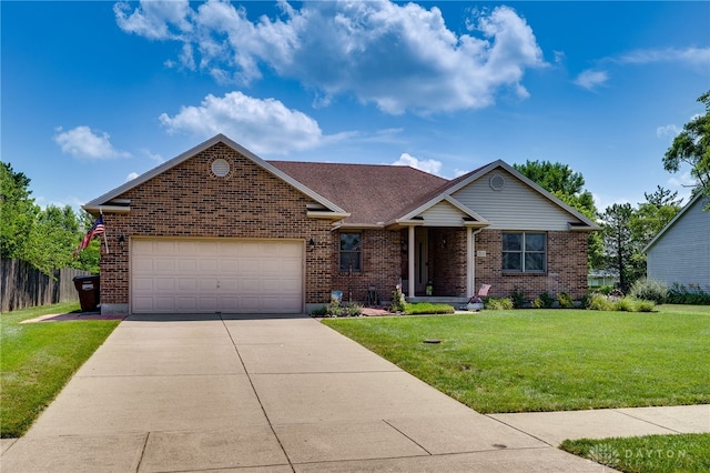 215 Christina Way, Franklin, OH 45005 - view of front of home with driveway, brick siding, an attached garage, and a front yard