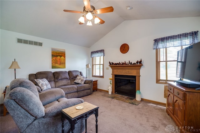 215 Christina Way, Franklin, OH 45005 - living area featuring light colored carpet, a ceiling fan, lofted ceiling, and a fireplace with flush hearth