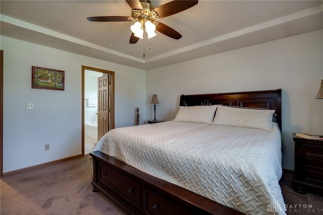 215 Christina Way, Franklin, OH 45005 - carpeted bedroom featuring a raised ceiling, ceiling fan, and ensuite bathroom