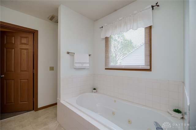 215 Christina Way, Franklin, OH 45005 - full bathroom with a whirlpool tub and baseboards