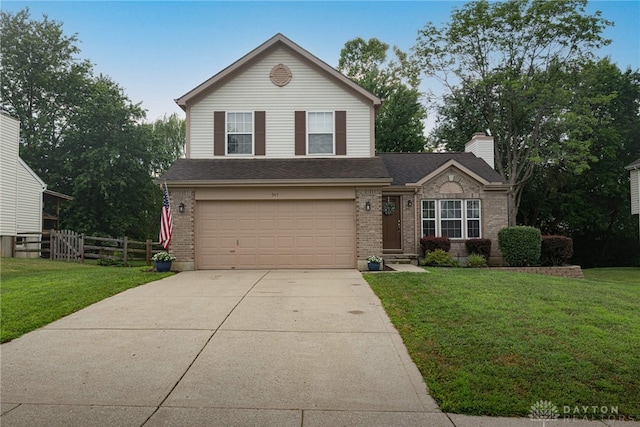 947 Stone Ridge Ln, Lebanon, OH 45036 - traditional-style house with brick siding, an attached garage, concrete driveway, and a chimney