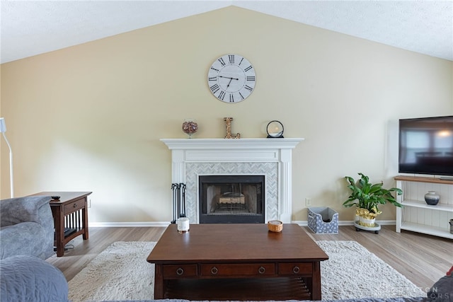 947 Stone Ridge Ln, Lebanon, OH 45036 - living area with lofted ceiling, wood finished floors, and a tiled fireplace