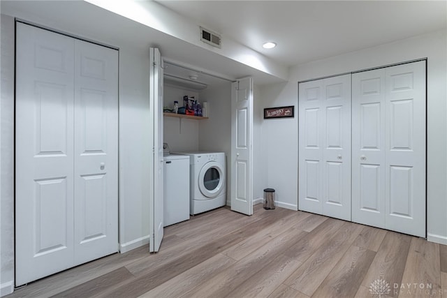 947 Stone Ridge Ln, Lebanon, OH 45036 - laundry area featuring separate washer and dryer, light wood-type flooring, and recessed lighting