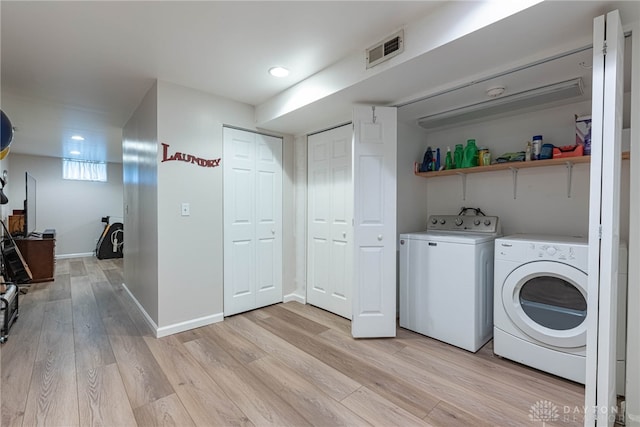 947 Stone Ridge Ln, Lebanon, OH 45036 - laundry room featuring washer and clothes dryer, light wood-style flooring, and recessed lighting
