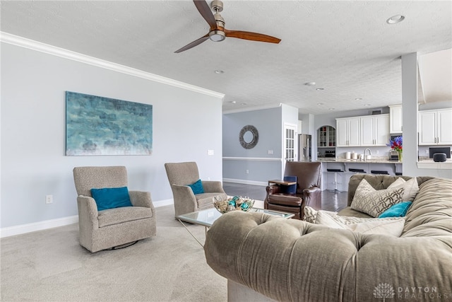 9282 Maple Brook St, Clearcreek Twp, OH 45458 - living room with a ceiling fan, ornamental molding, light colored carpet, recessed lighting, and a textured ceiling