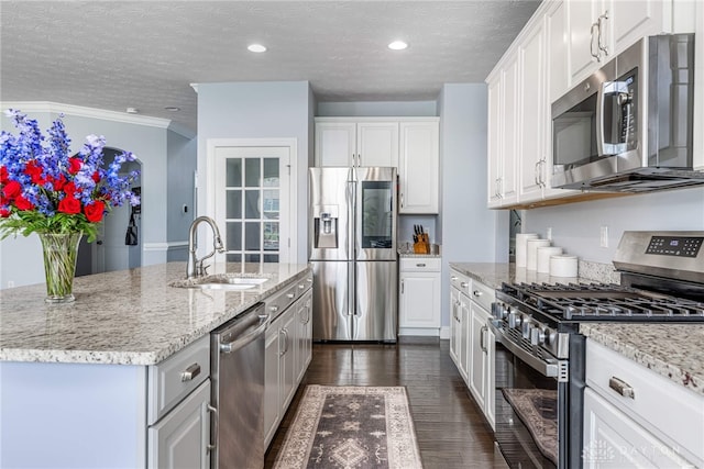 9282 Maple Brook St, Clearcreek Twp, OH 45458 - kitchen with stainless steel appliances, white cabinetry, a textured ceiling, light stone counters, and dark wood-style flooring