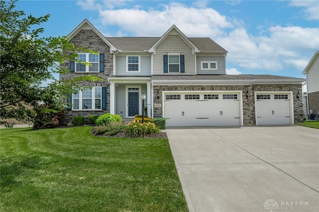 9282 Maple Brook St, Clearcreek Twp, OH 45458 - view of front of house featuring stone siding, driveway, a front yard, and roof with shingles