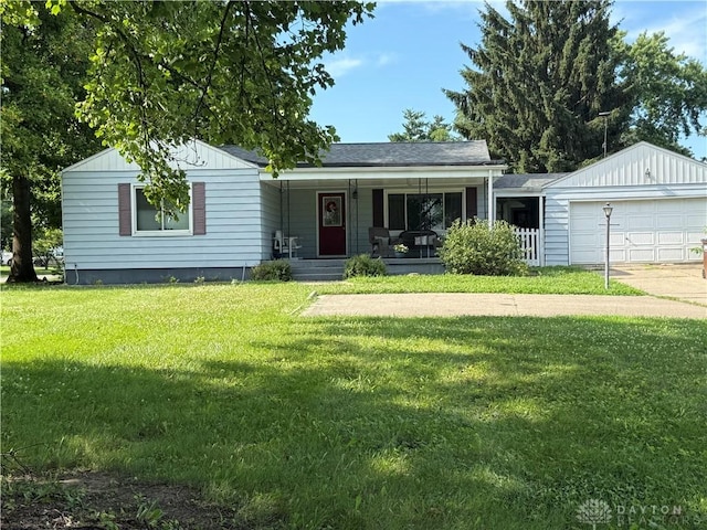 5001 Central Ave, Middletown, OH 45044 - ranch-style home with an attached garage, covered porch, a front yard, driveway, and board and batten siding