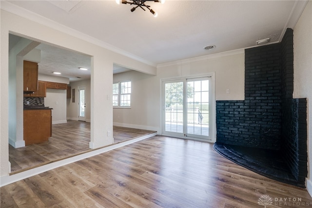 3183 Myers Tillman Rd, Arcanum, OH 45304 - unfurnished living room featuring crown molding and light wood-style floors