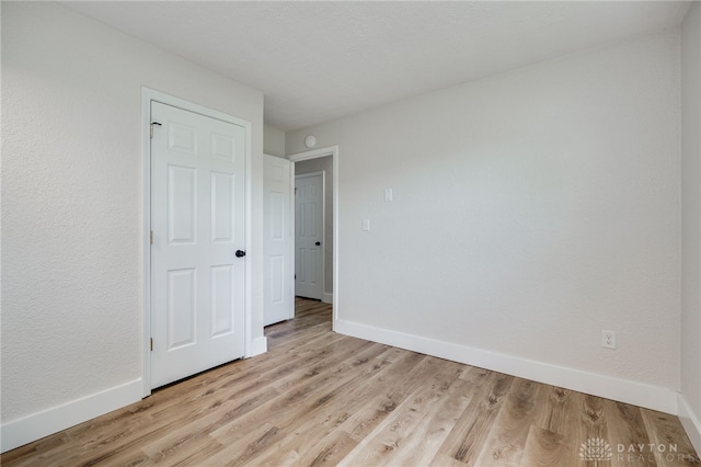 3183 Myers Tillman Rd, Arcanum, OH 45304 - unfurnished bedroom with baseboards and light wood finished floors