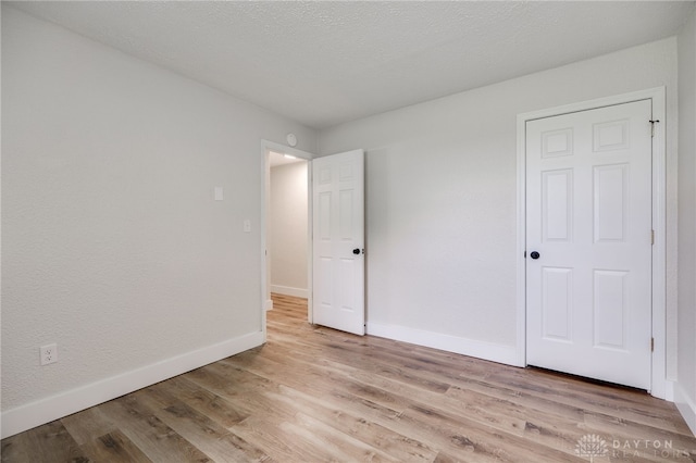 3183 Myers Tillman Rd, Arcanum, OH 45304 - unfurnished bedroom with light wood-style floors and baseboards