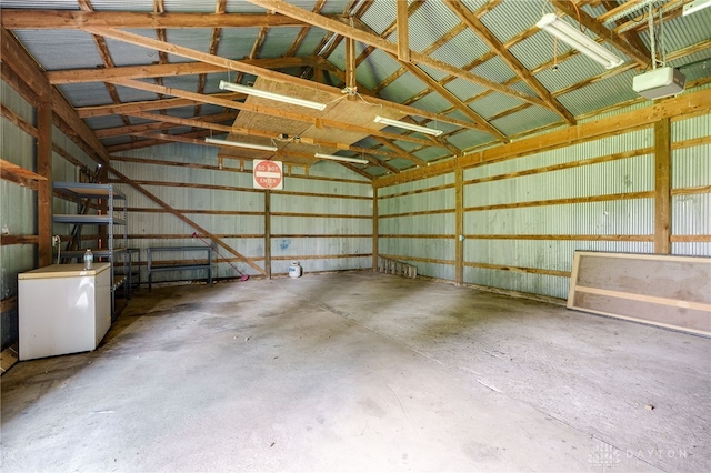 3183 Myers Tillman Rd, Arcanum, OH 45304 - garage with a garage door opener, fridge, and metal wall
