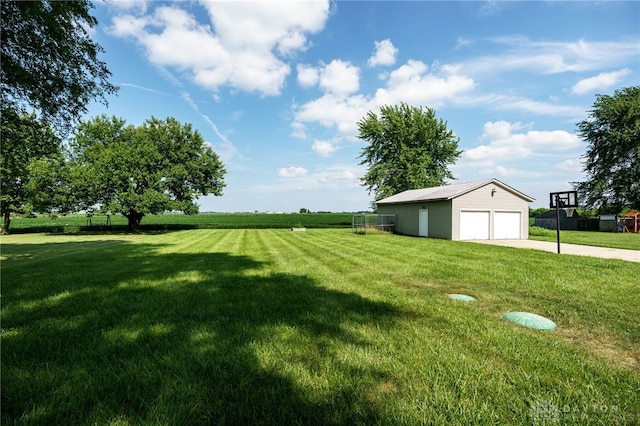 3183 Myers Tillman Rd, Arcanum, OH 45304 - view of grassy yard with an outdoor structure, a detached garage, and concrete driveway