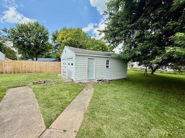 135 B St, Wilmington, OH 45177 - view of yard featuring an outdoor structure and a garage