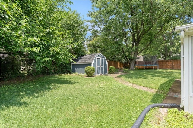 829 E Stroop Rd, Kettering, OH 45429 - fenced backyard featuring a trampoline and a storage unit