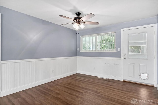 829 E Stroop Rd, Kettering, OH 45429 - spare room with a wainscoted wall, dark wood-style flooring, and a ceiling fan