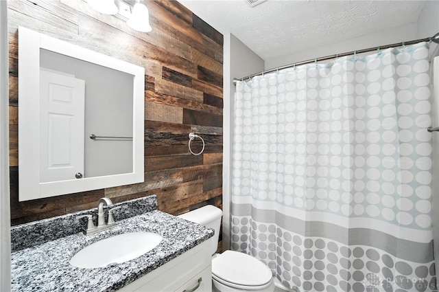 3492 King Edward Way, Beavercreek, OH 45431 - bathroom featuring wooden walls, vanity, a shower with shower curtain, and a textured ceiling