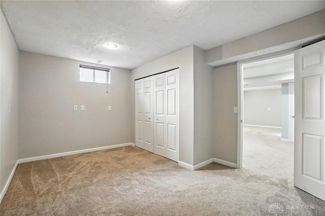 3492 King Edward Way, Beavercreek, OH 45431 - unfurnished bedroom featuring carpet flooring, a textured ceiling, and a closet