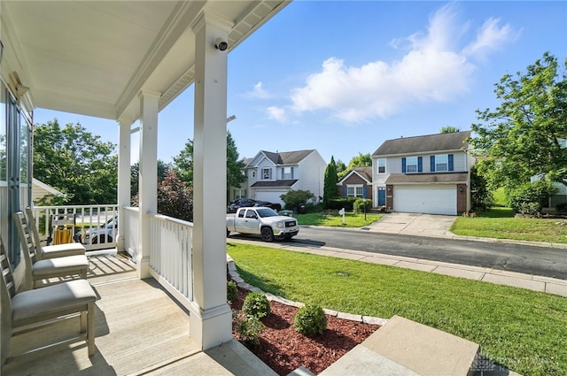 3492 King Edward Way, Beavercreek, OH 45431 - wooden porch featuring a residential view, a yard, and an attached garage