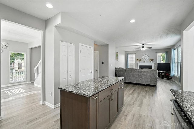 3492 King Edward Way, Beavercreek, OH 45431 - kitchen featuring ceiling fan, light wood-type flooring, a fireplace, plenty of natural light, and recessed lighting