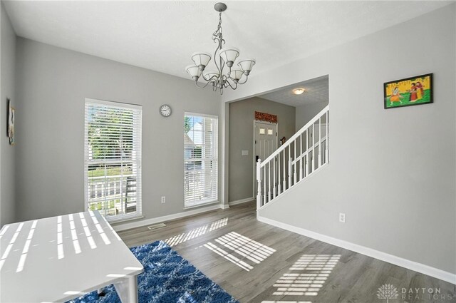 3492 King Edward Way, Beavercreek, OH 45431 - entrance foyer with a chandelier, wood finished floors, and stairs