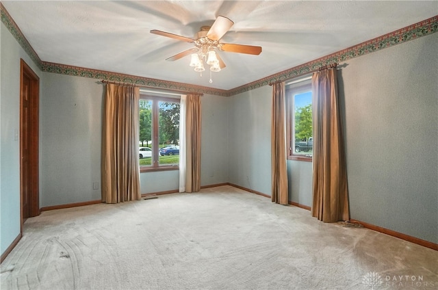 3820 Shagbark Ln, Beavercreek, OH 45440 - spare room featuring plenty of natural light, light colored carpet, and ceiling fan