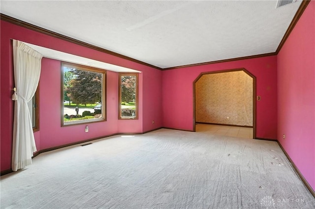 3820 Shagbark Ln, Beavercreek, OH 45440 - unfurnished room with ornamental molding, carpet floors, arched walkways, and a textured ceiling