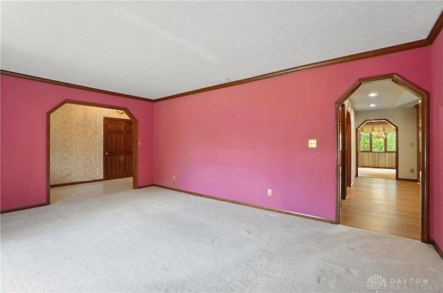3820 Shagbark Ln, Beavercreek, OH 45440 - carpeted spare room featuring arched walkways and ornamental molding