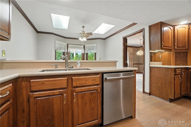 3820 Shagbark Ln, Beavercreek, OH 45440 - kitchen featuring dishwasher, a skylight, ornamental molding, light wood-type flooring, and brown cabinets
