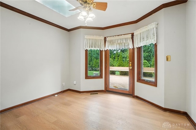 3820 Shagbark Ln, Beavercreek, OH 45440 - spare room with wood finished floors, ornamental molding, and a ceiling fan
