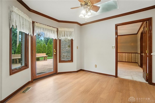 3820 Shagbark Ln, Beavercreek, OH 45440 - unfurnished room with light wood-type flooring, ceiling fan, and ornamental molding