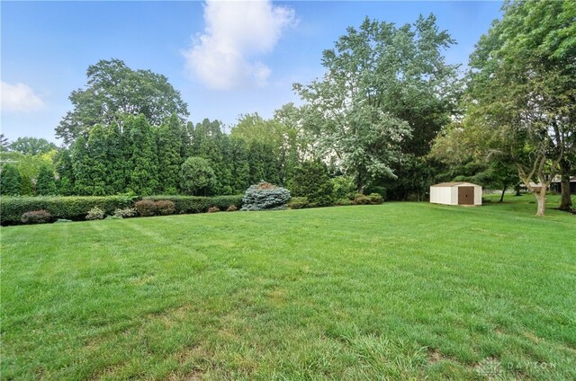 3820 Shagbark Ln, Beavercreek, OH 45440 - view of grassy yard featuring a storage unit