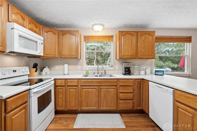 5431 Flicker Way, Dayton, OH 45424 - kitchen with white appliances, a textured ceiling, light countertops, and wood finished floors