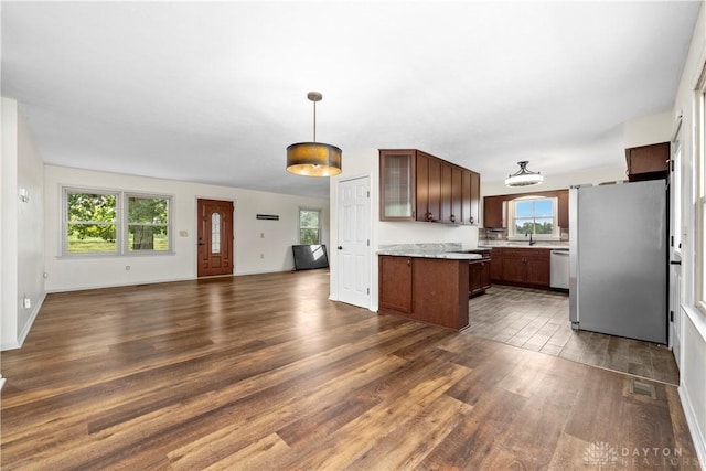 19551 US Highway 68, Fayetteville, OH 45118 - kitchen with freestanding refrigerator, open floor plan, dishwasher, dark wood-style flooring, and light countertops