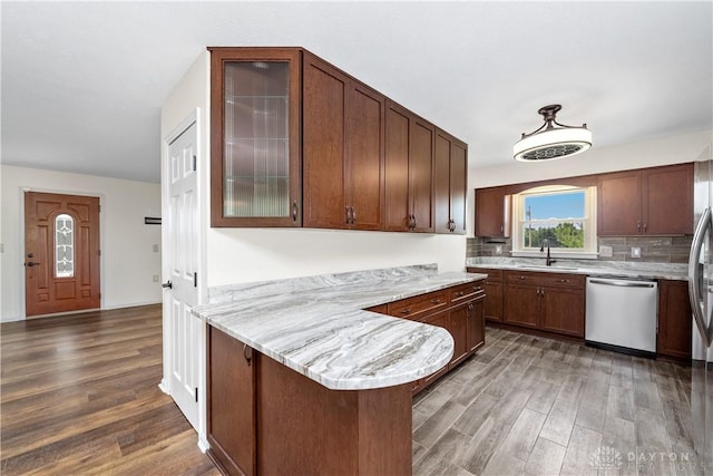 19551 US Highway 68, Fayetteville, OH 45118 - kitchen featuring stainless steel dishwasher, wood finished floors, a peninsula, and glass insert cabinets