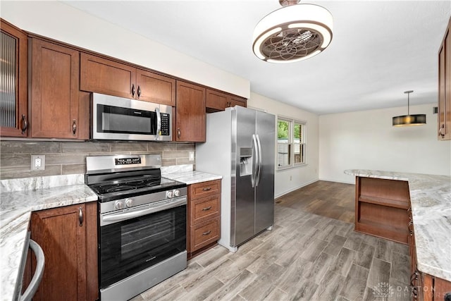 19551 US Highway 68, Fayetteville, OH 45118 - kitchen with appliances with stainless steel finishes, light wood-style flooring, backsplash, brown cabinets, and light stone counters