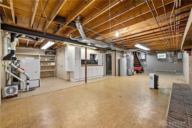 19551 US Highway 68, Fayetteville, OH 45118 - below grade area with stairs, electric water heater, water heater, and light flooring