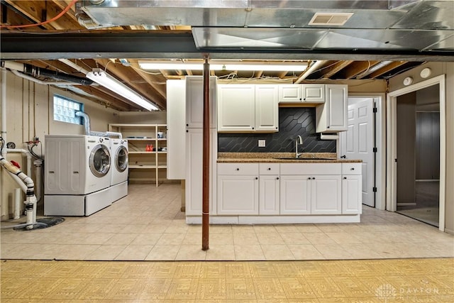 19551 US Highway 68, Fayetteville, OH 45118 - basement with washing machine and clothes dryer, light tile patterned floors, and drainage system