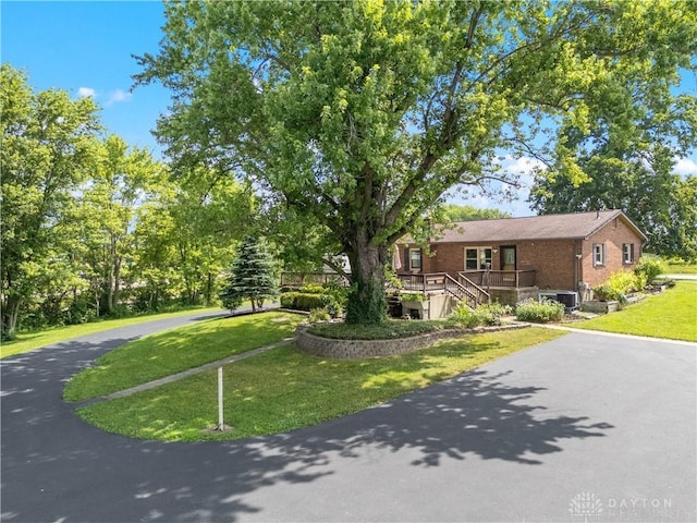19551 US Highway 68, Fayetteville, OH 45118 - view of front of property with brick siding, asphalt driveway, a front lawn, and stairs